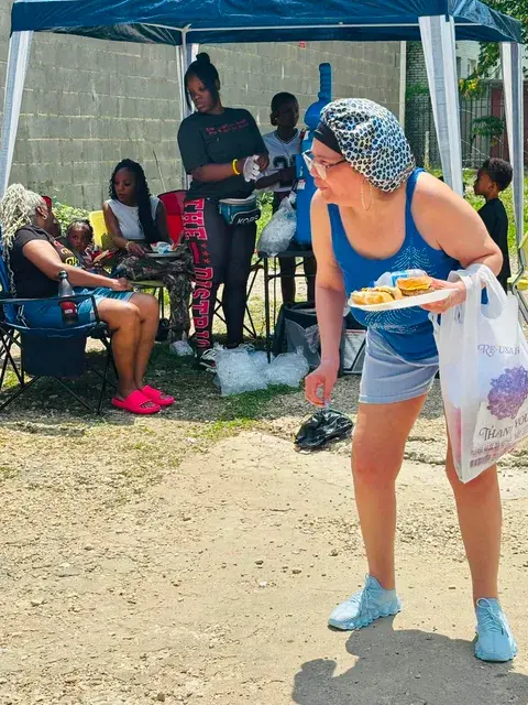 Community outreach participant receiving food and supplies