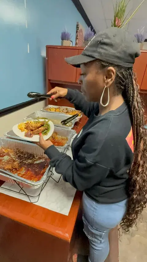 Volunteer serving food during a community event