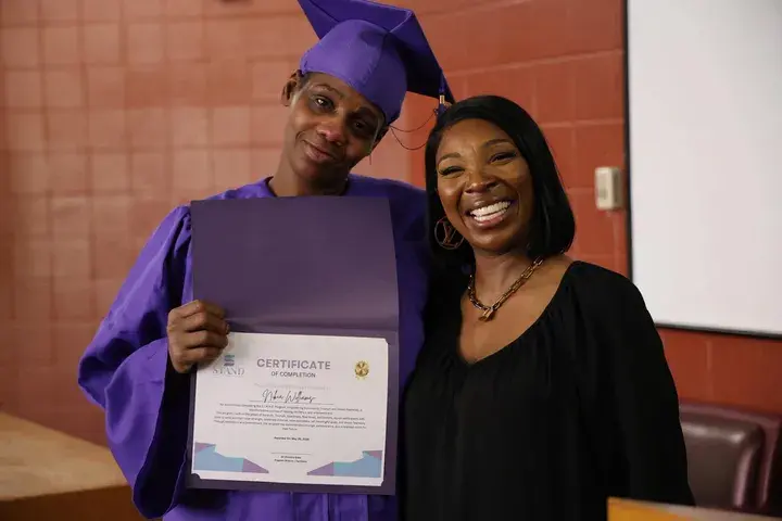 Graduate and community leader at the ceremony