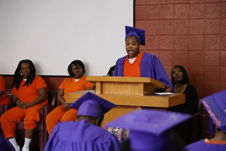 Graduate celebrating with family and supporters