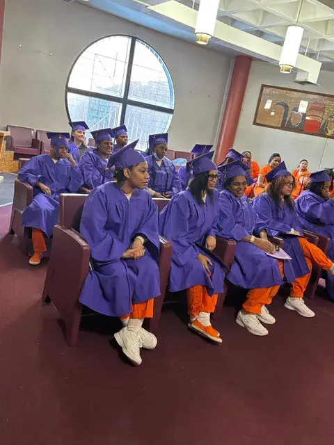 Graduates listening during the ceremony